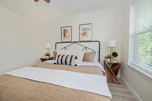 Bedroom featuring ceiling fan and light wood-type flooring