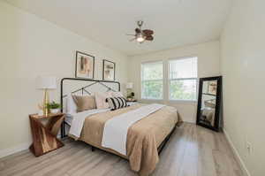 Bedroom featuring light wood-type flooring and ceiling fan