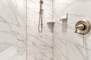 Bathroom featuring a tile shower