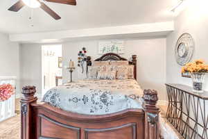 Bedroom with ceiling fan and wood-type flooring