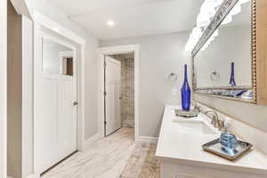 Bathroom featuring vanity and tile patterned flooring