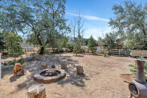 View of yard with a fire pit