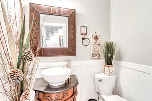 Bathroom featuring toilet and vanity