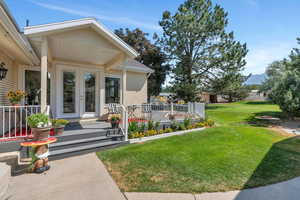 View of yard featuring french doors