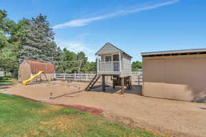 View of play area with a lawn