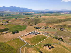 Drone / aerial view with a mountain view and a rural view