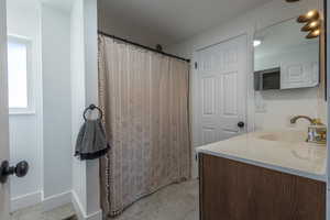 Bathroom featuring vanity and tile patterned floors