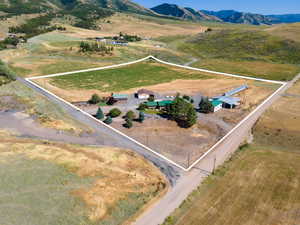 Birds eye view of property featuring a mountain view and a rural view