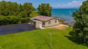 Birds eye view of property featuring a water view