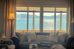 Living room featuring a water and mountain view