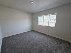 Spare room with carpet floors