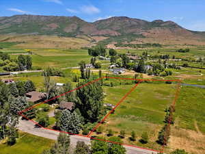 Birds eye view of property with a mountain view and a rural view