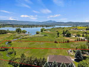 Bird's eye view with a water and mountain view and a rural view