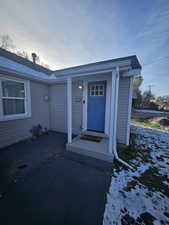 View of snow covered property entrance