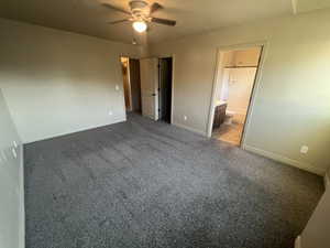 Unfurnished bedroom with carpet floors, connected bathroom, and ceiling fan