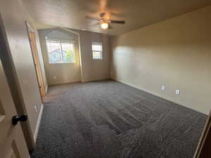 Spare room with carpet floors and ceiling fan