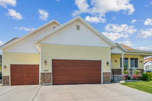 Craftsman-style home with a garage and covered porch