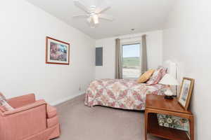 Bedroom with carpet, and ceiling fan