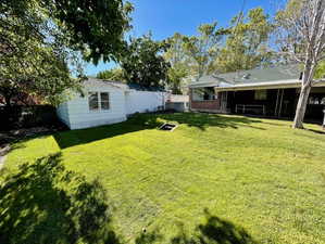 Excellent backyard and covered patio with a brand new lawn and sprinkler system