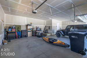 Garage featuring a garage door opener