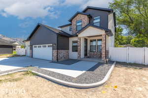 Craftsman house featuring a garage