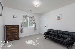 Living area featuring carpet flooring