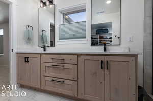 Bathroom with vanity and tile patterned flooring