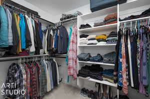 Walk in closet with carpet flooring