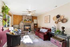 Gas log fireplace with stone surround and beautiful accent wall