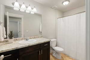 Bathroom with vanity and toilet