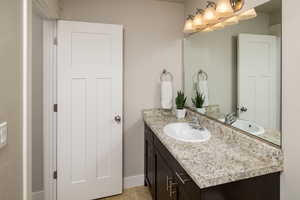 Bathroom with vanity and tile patterned flooring