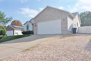 View of front of property featuring a garage