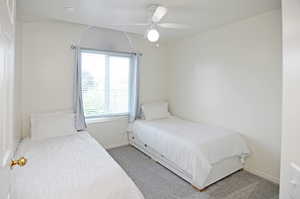 Bedroom with carpet flooring and ceiling fan