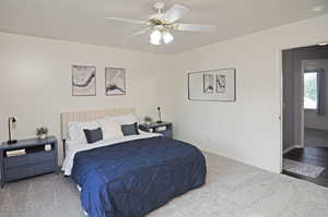 Bedroom featuring wood-type flooring and ceiling fan