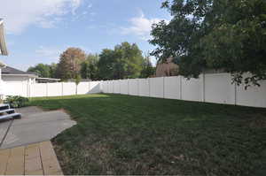 View of yard with a patio