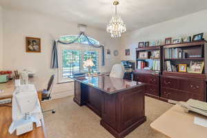 Office area with a chandelier