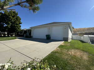 Garage featuring a yard