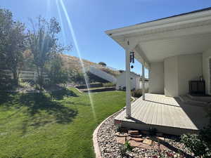 View of yard with a deck