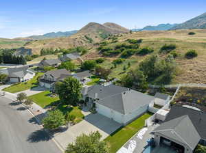 Birds eye view of property with a mountain view