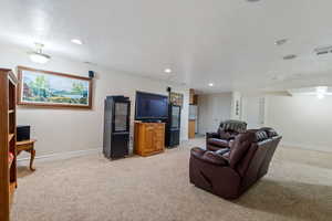 View of carpeted living room in the basement