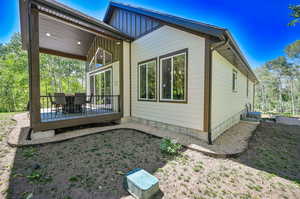 Rear view of property with a deck