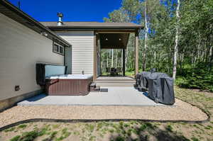 View of patio / terrace featuring a hot tub