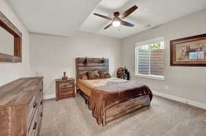 Bedroom with light colored carpet and ceiling fan