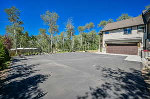 View of side of home with a garage