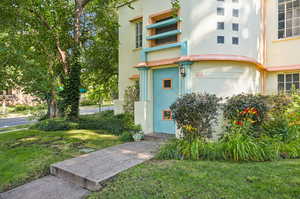 Property entrance with a lawn