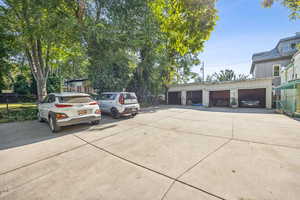 View of car parking featuring a garage