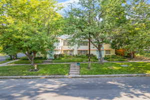 View of front of house with a front yard