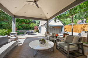 View of patio with outdoor lounge area, ceiling fan, and a gazebo