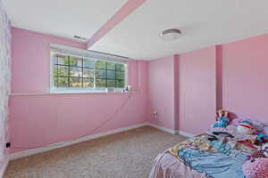 Unfurnished bedroom with carpet and a textured ceiling