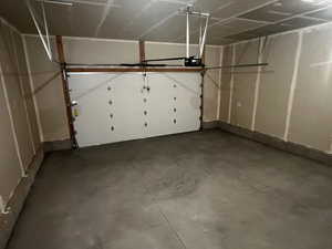 Garage featuring a garage door opener